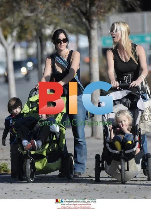 Carrie Anne Moss and friend out with kids
