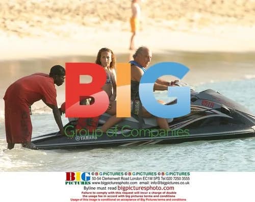 Simon Cowell jet skiing with Philip Green in Barbados