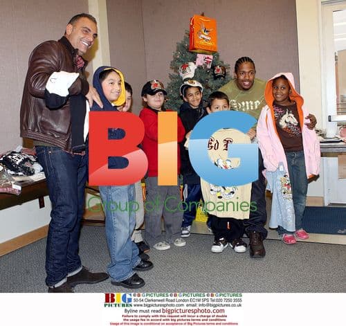 Christian Audigier and Nick Cannon Spread Holiday Cheer