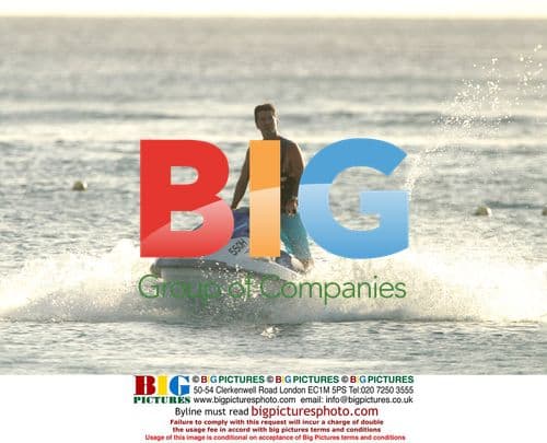 Simon Cowell and Philip Green on jet ski in Barbados