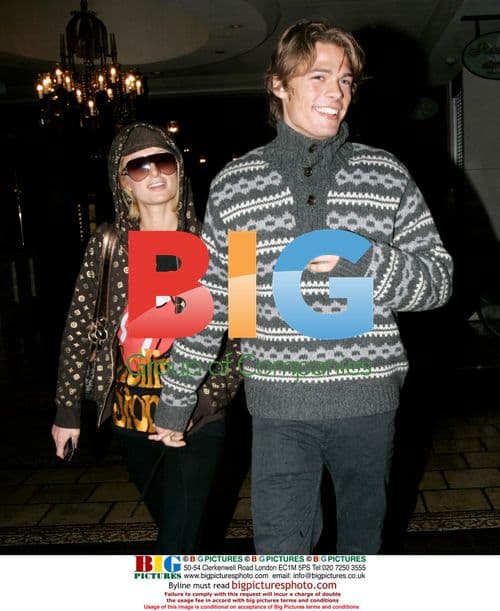 Paris Hilton and Boyfriend Brave Rain for Movie Date