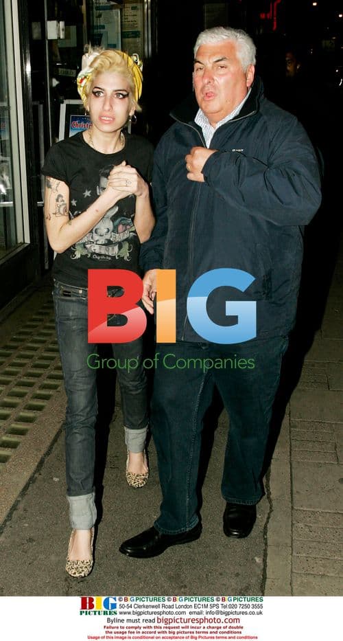 Amy Winehouse's new blonde look with dad Mitch