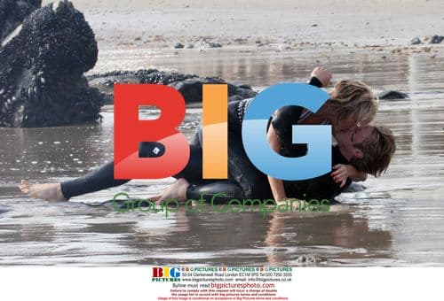 Kim Cattral and Jason Lewis heat up the sand