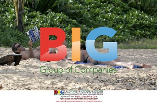 Pierce Brosnan and wife Keely on Hawaii beach