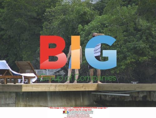 Sir Trevor McDonald on beach in Jamaica