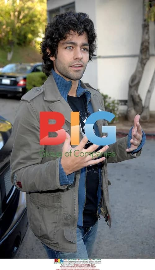 Adrien Grenier plays with kitty