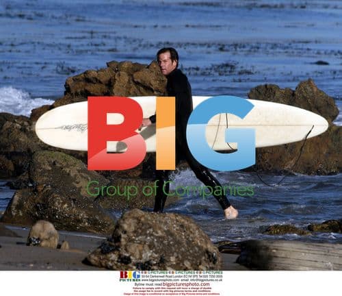 Danny Moder rides longboard in Malibu