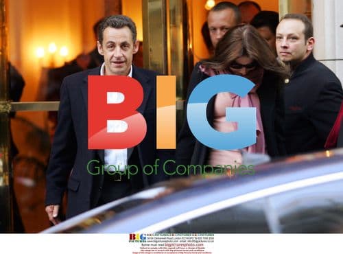 Sarkozy Exits Hotel with Carla Bruni