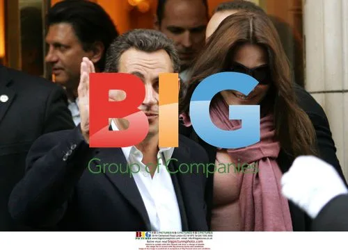 Sarkozy and Bruni Exit Bristol Hotel