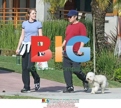 James Spader walks with girlfriend and dog