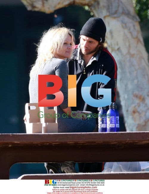 Pamela Anderson and Rick Salomon get frisky in Malibu park
