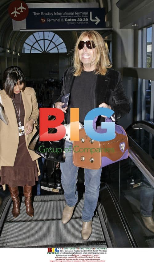 Steven Cojocaru with Puppy at LAX