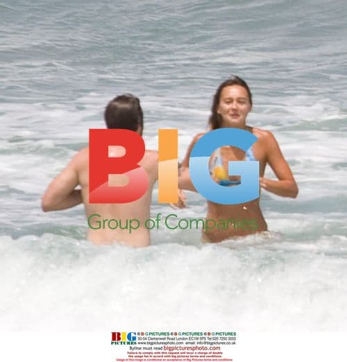 Sharni Vinson and AJ Buckley on the beach in Sydney