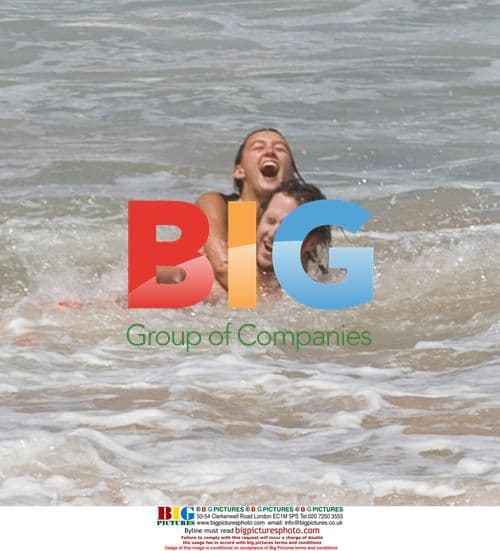 Sharni Vinson and AJ Buckley on Sydney beach