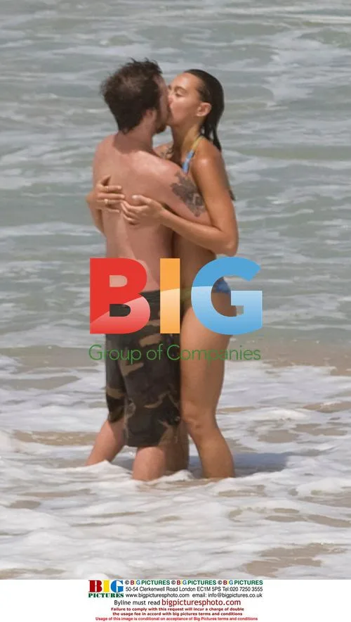 Sharni Vinson and AJ Buckley on Sydney beach