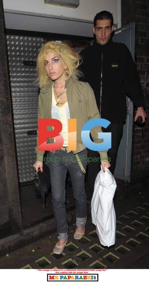 Amy Winehouse and father visiting lawyer office