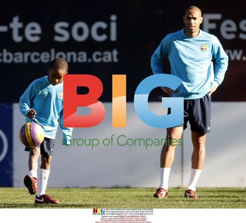 Thierry Henry plays with Lilian Thuram's son