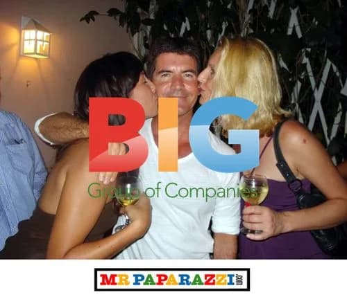 Simon Cowell gets kissed in Barbados