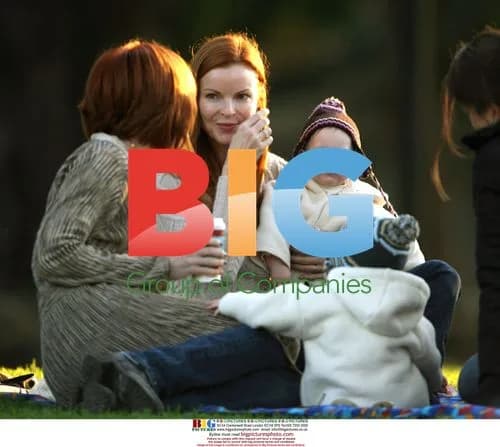 Marcia Cross plays with twins in park