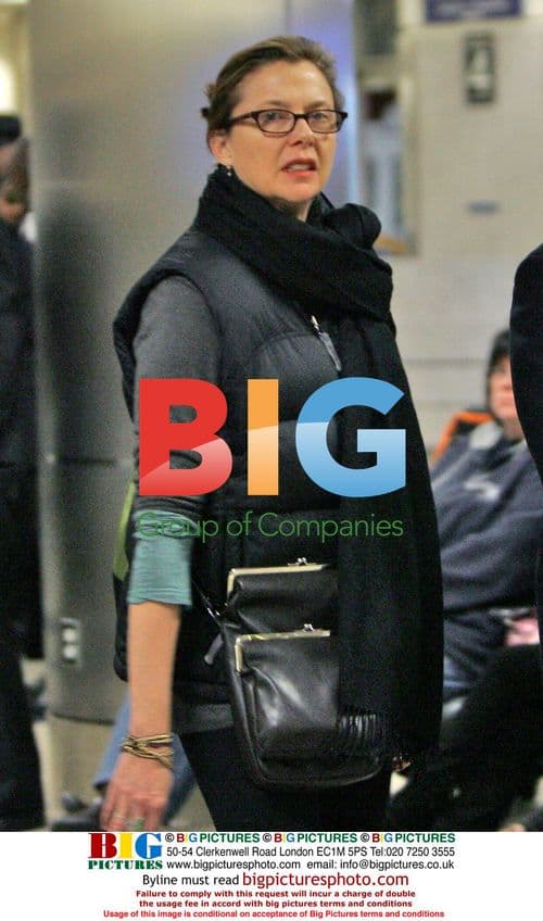 Annette Benning arrives at LAX with son