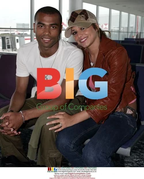 Ashley Cole with Cheryl Tweedy at Heathrow