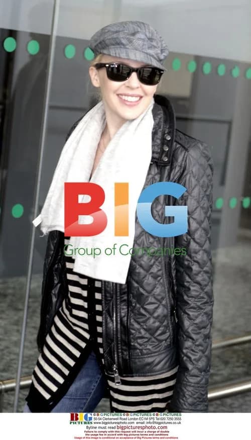 Kylie Minogue Arrives at London Airport