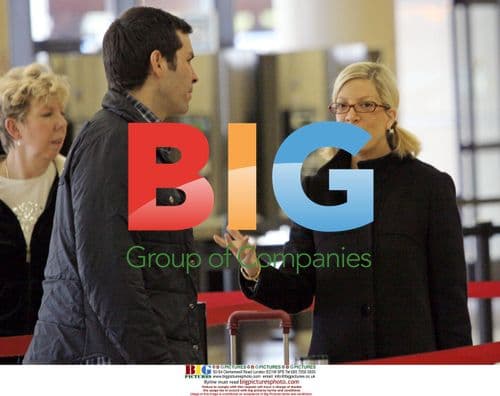 Tori Spelling Departs LAX with Colorful Suitcase