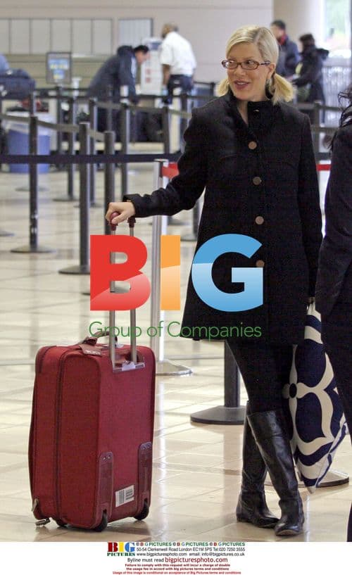 Tori Spelling Departs LAX with Red Suitcase