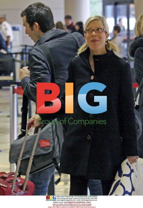 Tori Spelling Departs LAX with Colorful Suitcase