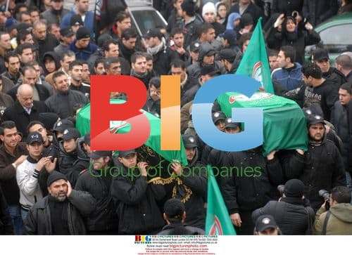 Amal Members Carry Coffins in Beirut