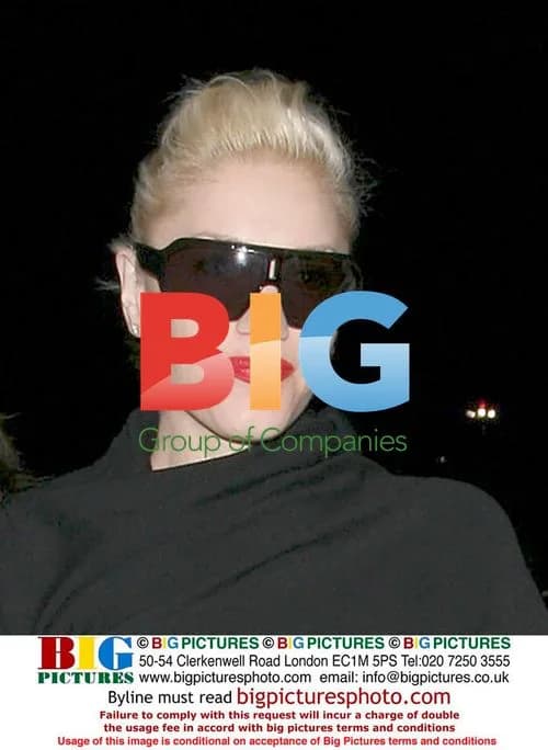 Gwen Stefani Covers Baby Bump at LAX