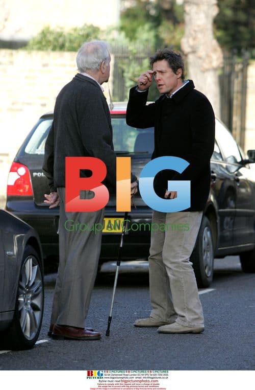 Hugh Grant strolling home alone