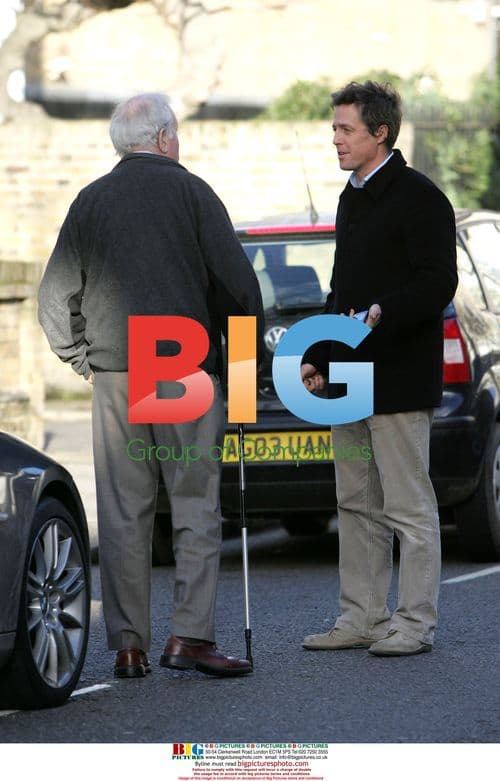 Hugh Grant spotted walking alone