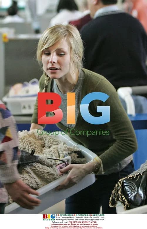 Kristen Bell Departs LAX with Male Friend