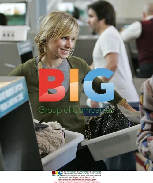 Kristen Bell departs LAX with male friend