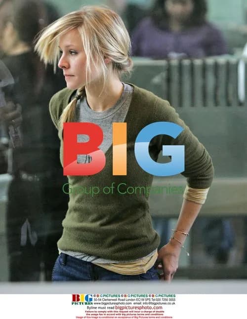Kristen Bell departs LAX with male friend