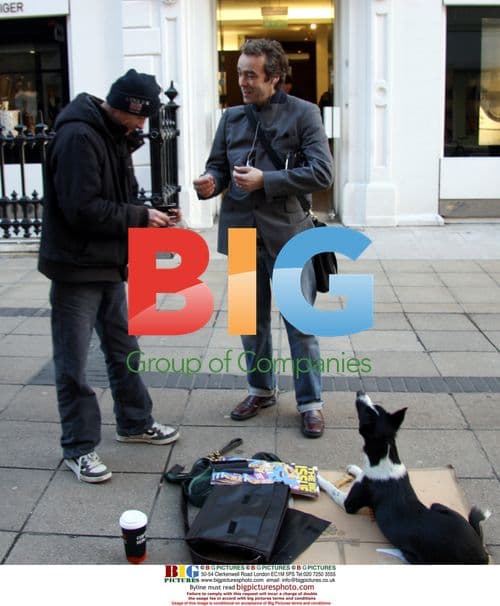 John Hannah signs autograph for Big Issue seller