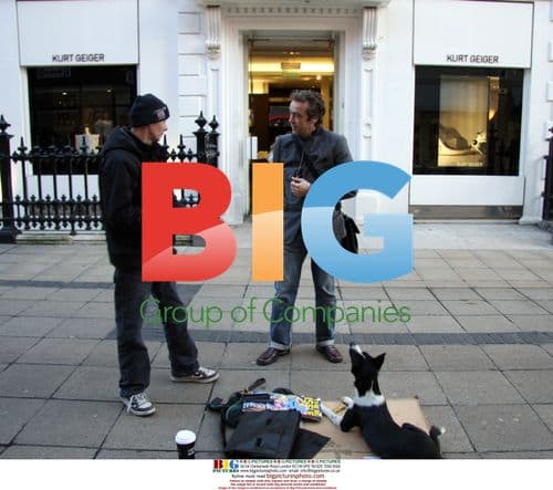 Actor John Hannah signs autograph for Big Issue seller