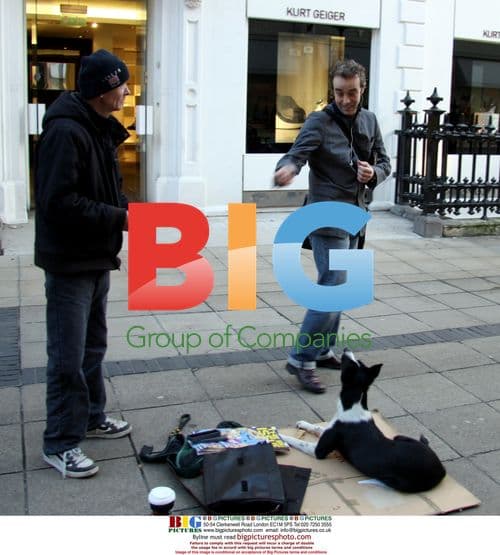 John Hannah signs autograph for Big Issue seller