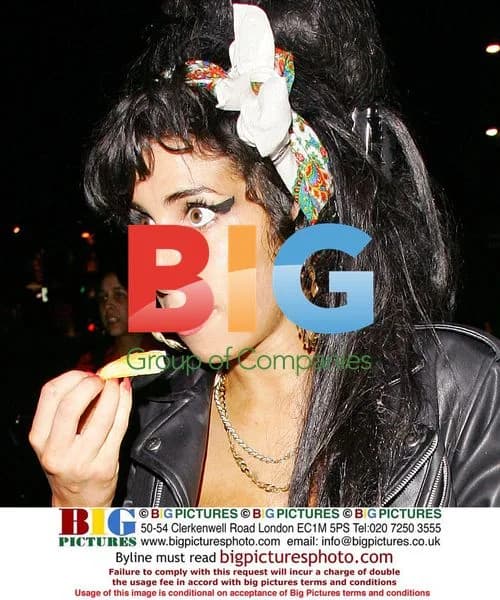 Amy Winehouse Leaves Home with Mystery Man
