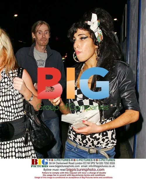 Amy Winehouse leaves London home with mystery man