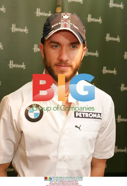 F1 Driver Nick Heidfeld Signs Merchandise at Harrods
