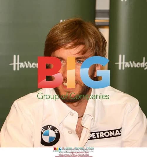 F1 Driver Nick Heidfeld Signs Merch
