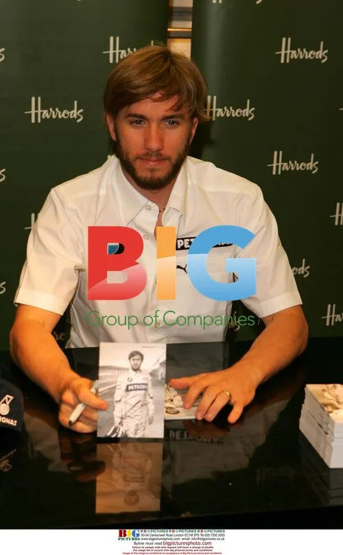 F1 Driver Nick Heidfeld Signs Merch at Harrods