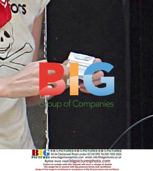 Blonde celebrity rides bike, smokes