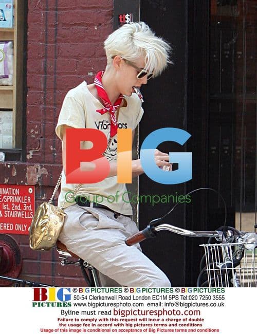 Celebrity on Bike in Casual Outfit