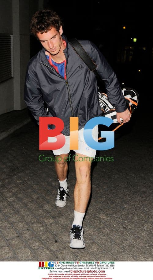 Tennis player in blue jacket