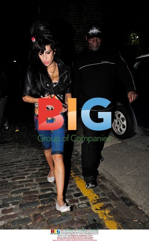 Amy Winehouse leaves home with mystery man