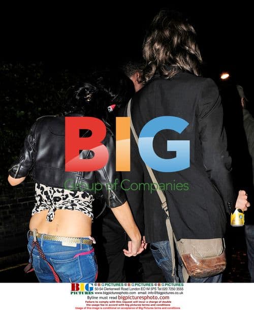 Amy Winehouse leaves Camden home with mystery man