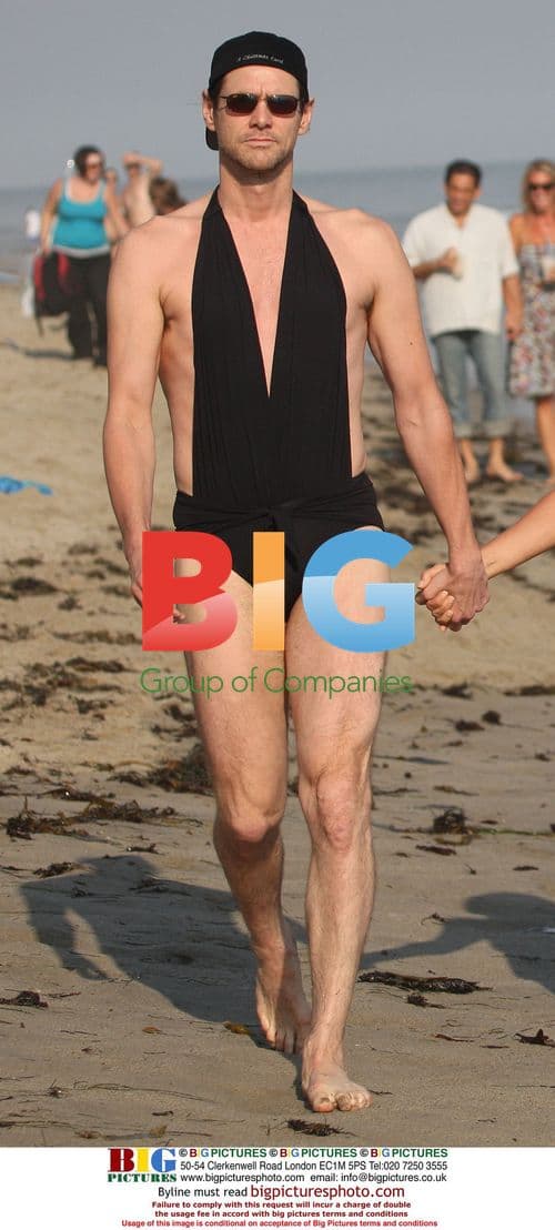 Jim Carrey and Jenny McCarthy walk on Malibu beach